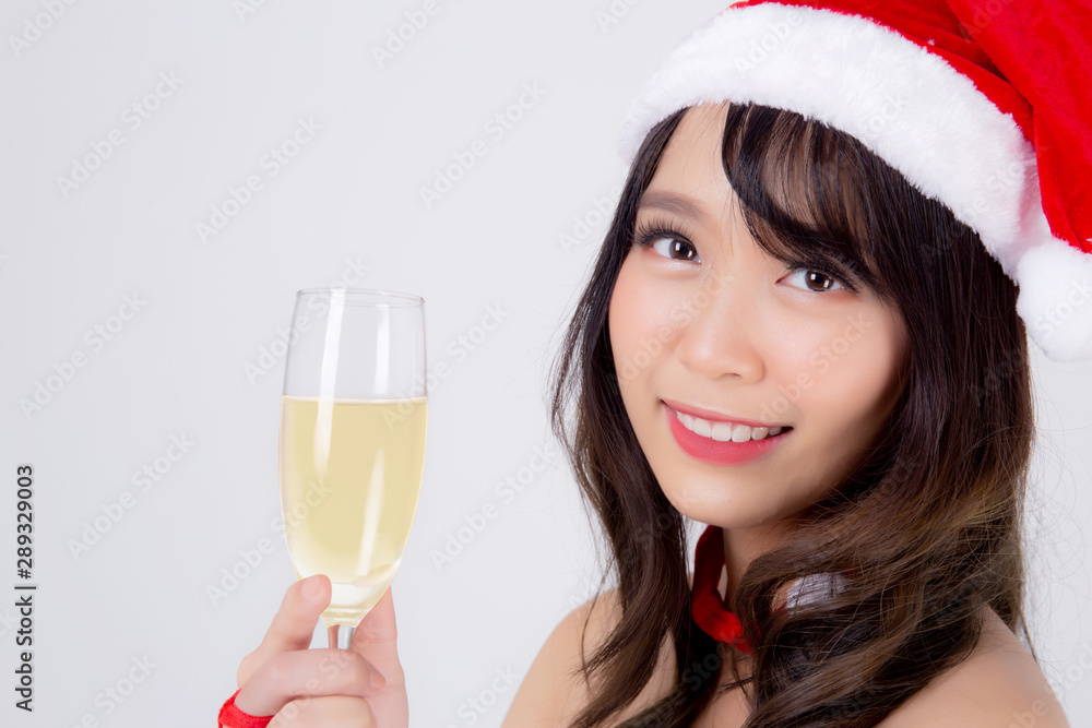 Beautiful portrait young asian woman in Santa holding glass of champagne with party celebrating in xmas holiday isolated on white background, asia girl drink beverage, Christmas and new year concept. Beautiful portrait young asian woman in Santa holding glass of champagne with party celebrating in xmas holiday isolated on white background, asia girl drink beverage, Christmas and new year concept.
