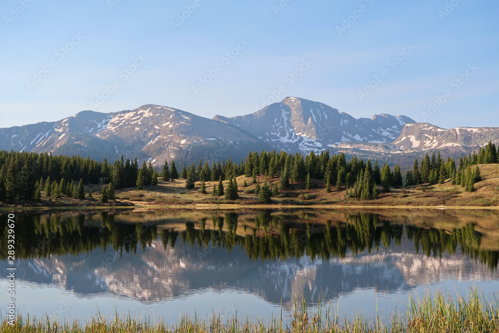 Landscape of Little Molas Lake, reflections, trees and the San Juan Mountains