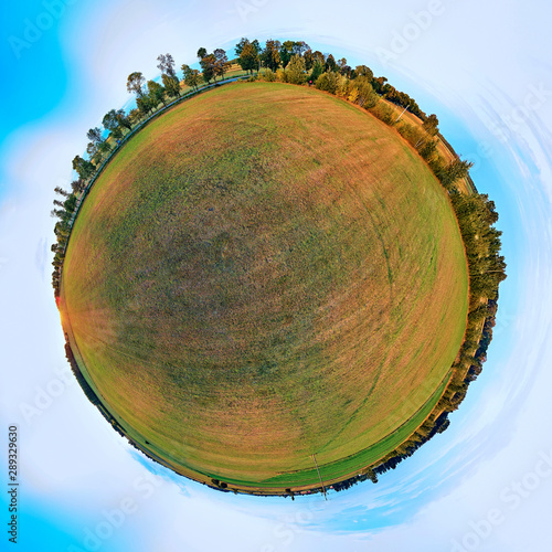 Beautiful 360 panoramic little planet aerial drone view to Bialowieza Forest - one of the last and largest remaining parts of the immense primeval forest that once stretched across the European Plain photo