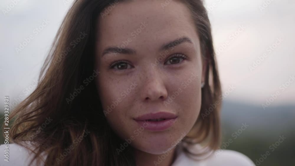 Cute young woman looking at camera. Fashionable girl traveling, connection with wild nature. Cute young woman looking at camera. Fashionable girl traveling, connection with wild nature.