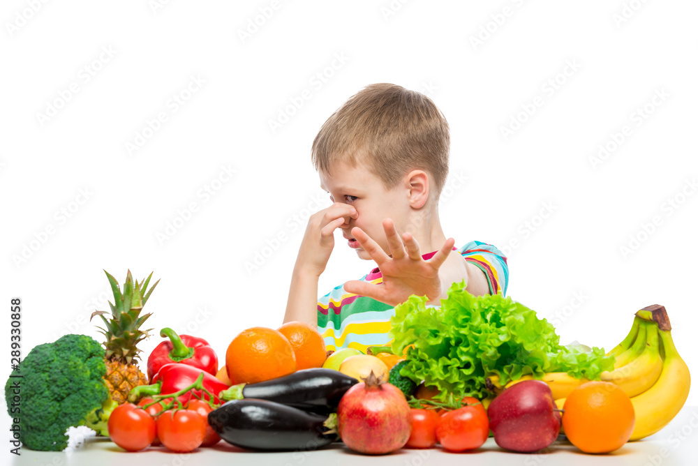 Boy and vegetables, unloved food concept photo Boy and vegetables, unloved food concept photo