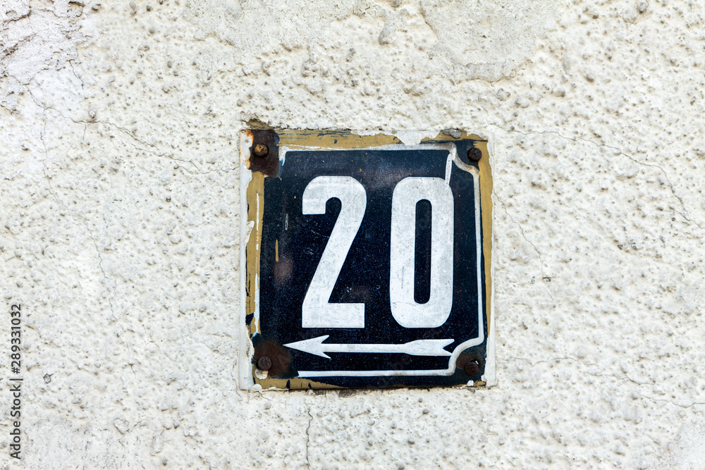 Number 20, twenty, street number sign on the wall Number 20, twenty, street number sign on the wall