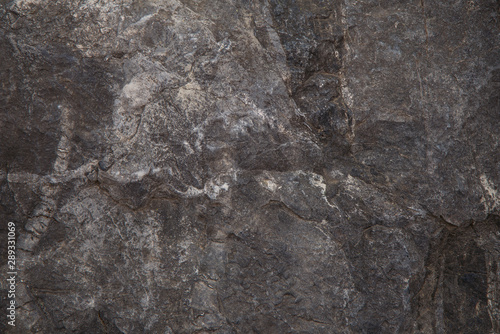 Natural brutal stone background with cracks and creases