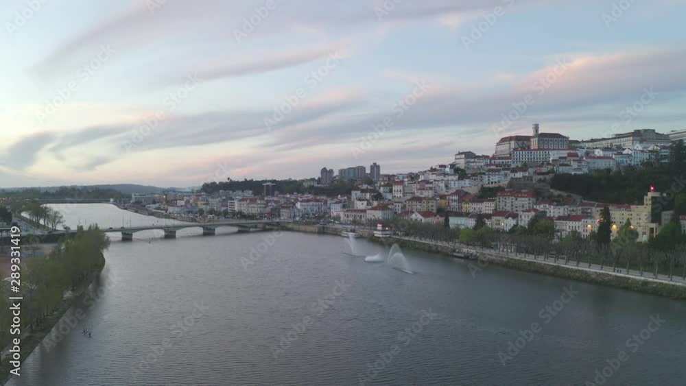 Aerial drone view of Coimbra city and Mondego river at sunset Aerial drone view of Coimbra city and Mondego river at sunset