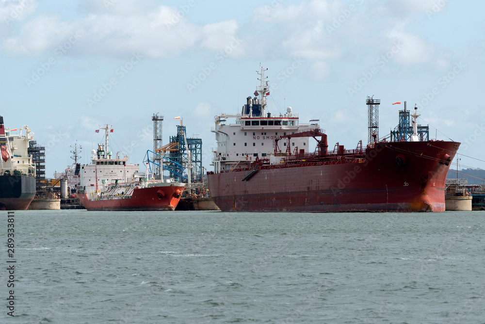 Fawley, Southampton, England, UK. September 2019. Oil and chemical tanker ships alongside discharging their cargo to a refinery.