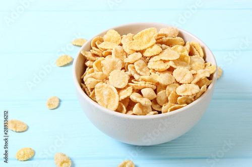 dry breakfast in a plate on a colored background top view. cereal