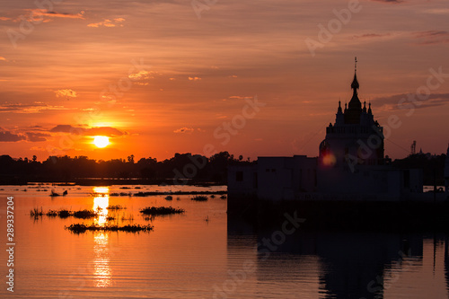 Temple in the lake at sunset scene in Mandalay, Myanmar
