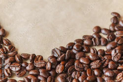 Closeup of roasted black coffee beans © YEEKAZAR