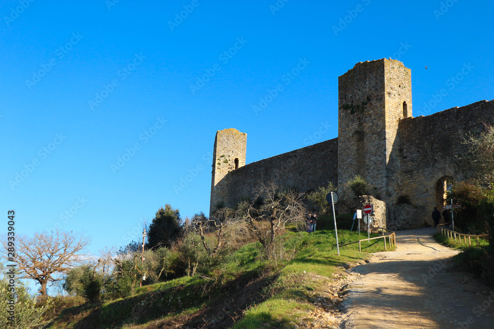 Entrance gate to medieval Monteriggioni castle in Tuscany, Italy