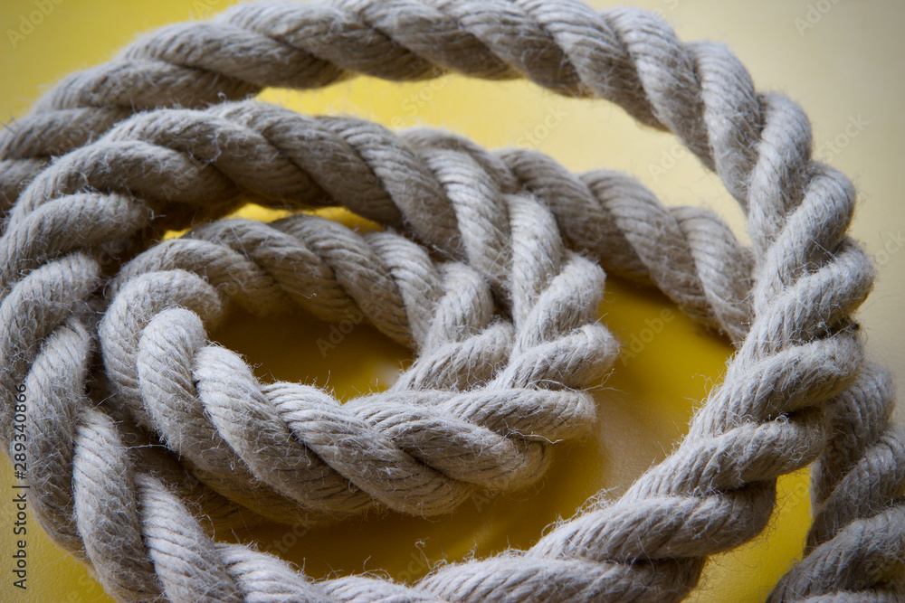 A coiled length of natural hemp rope