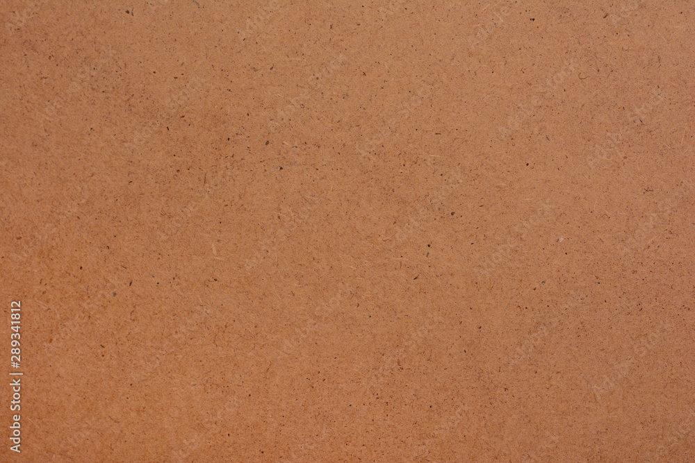 rough brown paper in an even layer. background image rough brown paper in an even layer. background image