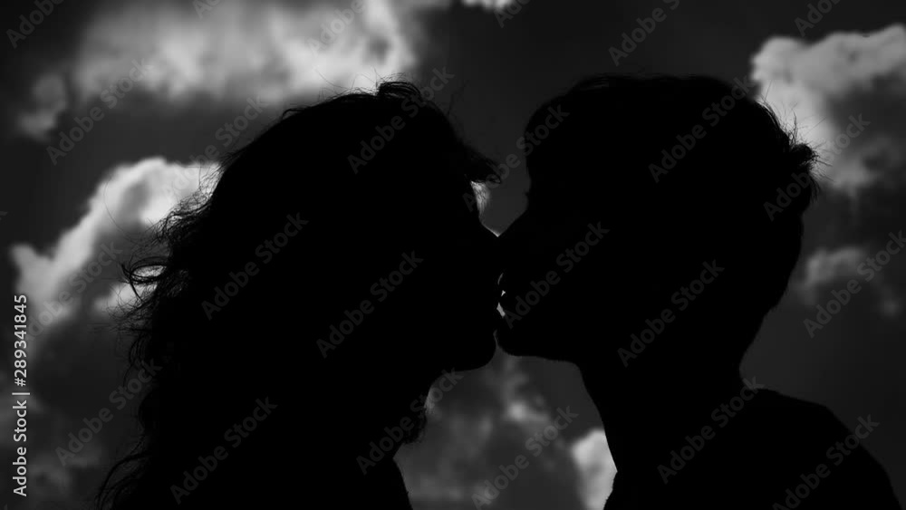 young couple in black and white kissing. Romanticism, love, tenderness Stock ビデオ Adobe Stock