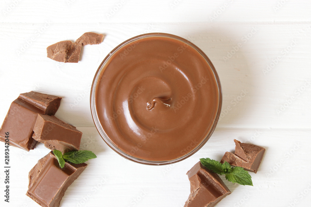 Obraz na płótnie chocolate cream on a colored background top view. chocolate butter, chocolate paste. w salonie