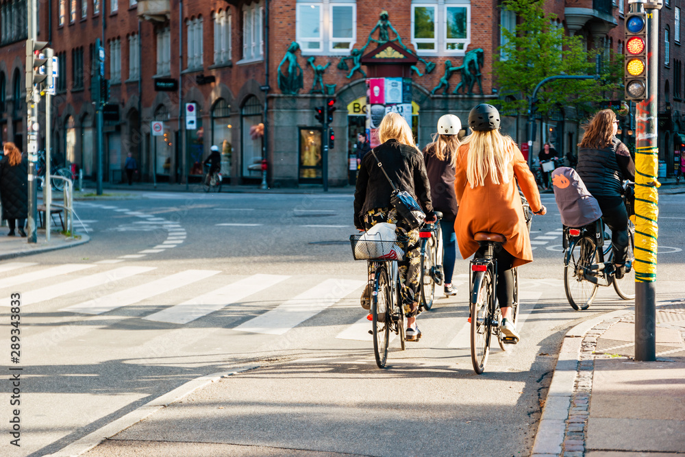 Street life in Copenhagen. People riding bikes in the city center. Street life in Copenhagen. People riding bikes in the city center.