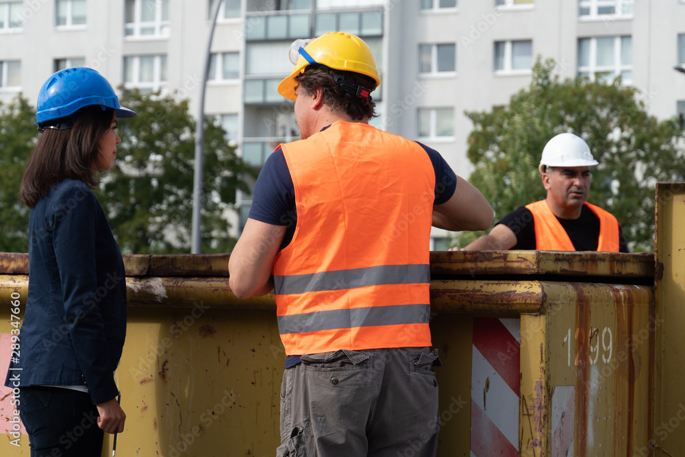 Three workers on construction site Three workers on construction site