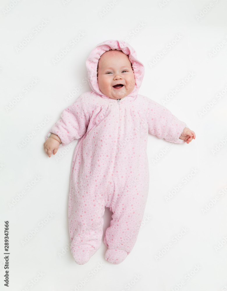 Cute baby dressed in warm overall for winter cold weather. Cute baby dressed in warm overall for winter cold weather.