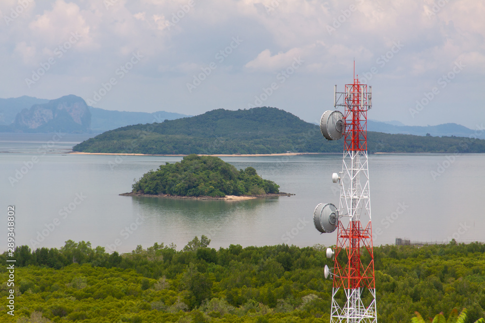 Seaview with various islands, clouds, and satellite tower on the foreground. Koh Phangan island, Thailand