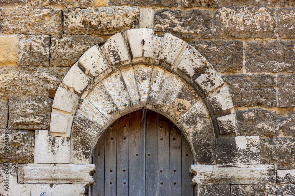 Italy, Bari, view and details of the Swabian castle, an imposing fortress dating back to the 13th century. Door detail