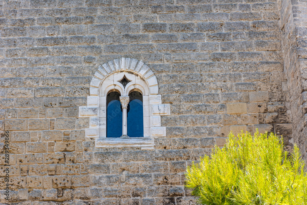 Italy, Bari, view and details of the Swabian castle, an imposing fortress dating back to the 13th century. Window detail Italy, Bari, view and details of the Swabian castle, an imposing fortress dating back to the 13th century. Window detail