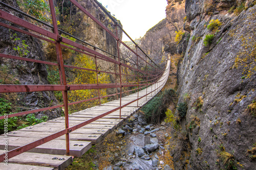 Wallpaper Mural Hiking trail Los Cahorros de Monachil (Granada) in Autumn. Impressive gorge carved by the Monachil River. It is a place of singular beauty with waterfalls, caves and suspension bridges. Torontodigital.ca