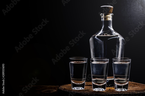 Aguardiente or aguardente Traditional Spanish and Brazilian alcoholic drink, strong drink, grape brandy, rum, gin, silver tequila, pinga, Brazilian cachaça, Russian vodka, in glasses photo
