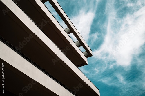 building with blue sky and clouds