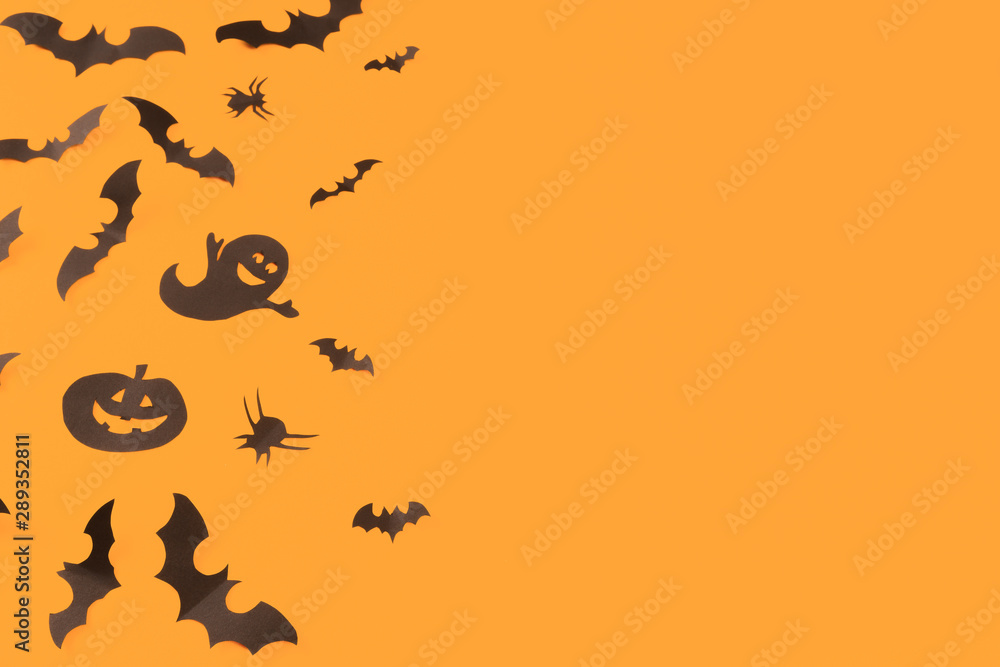 Halloween paper decorations on orange background. Halloween concept. Flat lay, top view, copy space - Image