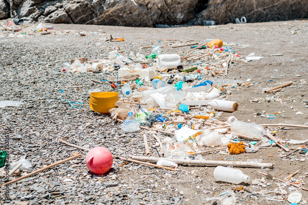 Plastic and garbage polluted beach in the Mediterranean Sea