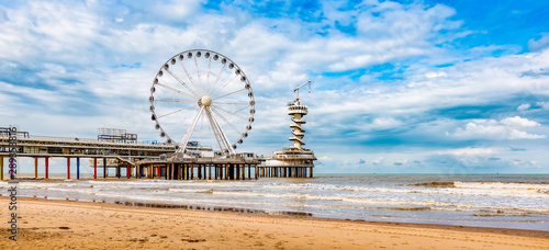 Panoramic landscape view of the Ferris Wheel and the Pier at Scheveningen. photo