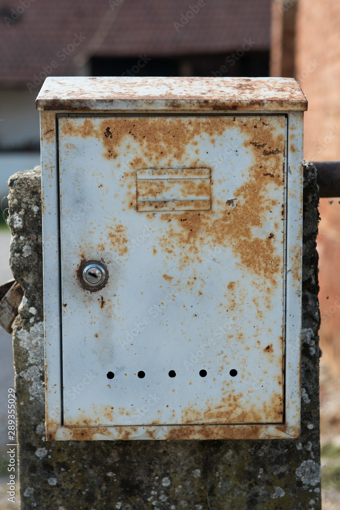 Old rusty metal mailbox in grey colour. Rusty grey mailbox Old rusty metal mailbox in grey colour. Rusty grey mailbox