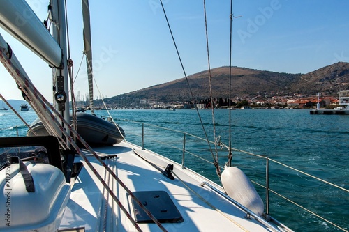 Boats on the Adriatic Sea from the deck of a yacht. Cruise from harbor Trogir - Croatia. Sailing on a yacht. Holiday in Croatia. Transport at sea. © martinfredy