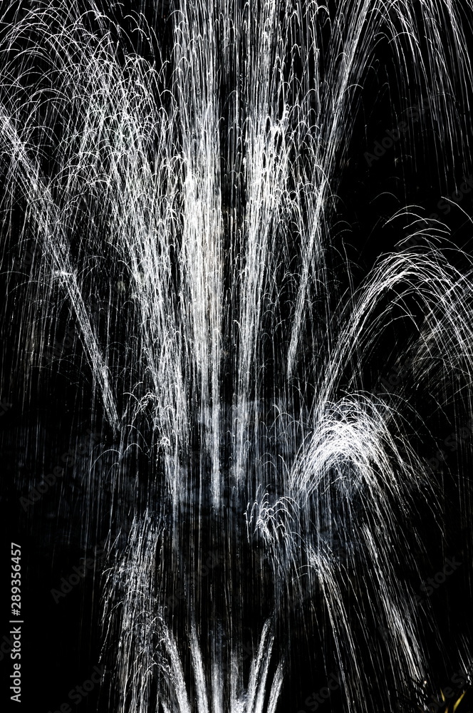 The light thought the water drops of a fountain The light thought the water drops of a fountain
