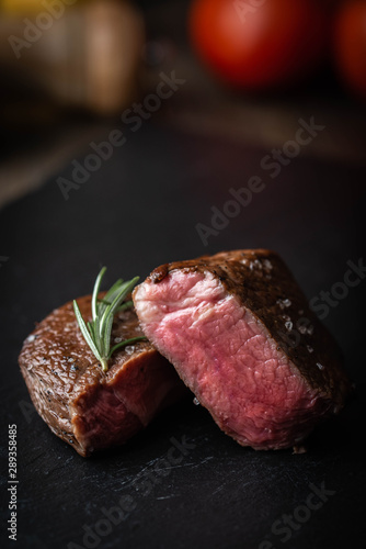 Photography rare grilled tenderloin beef steak on cutting board with vegetables
