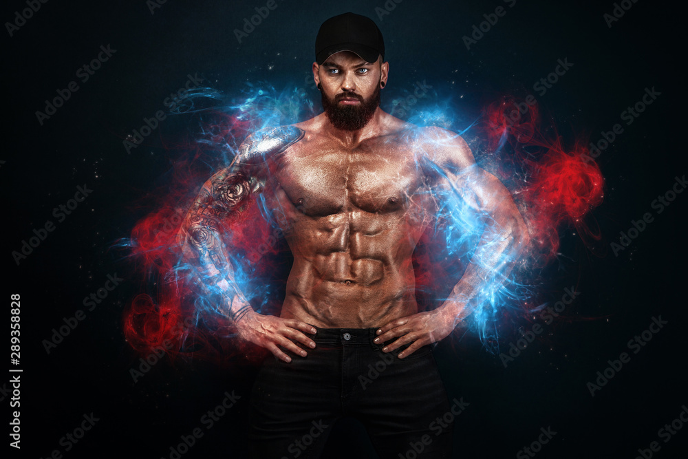 Strong and fit man bodybuilder. Sporty muscular guy. Spot and fitness motivation. Man on fire like a phoenix. Strong and fit man bodybuilder. Sporty muscular guy. Spot and fitness motivation. Man on fire like a phoenix.