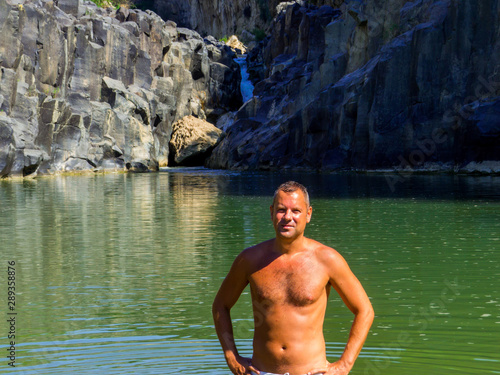 Handsome Italian Man on the Pellicone Lake in Vulci, Italy photo