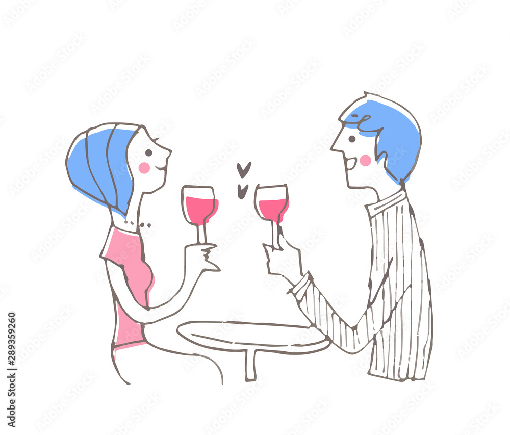 赤ワインで乾杯する若いカップル 赤ワインで乾杯する若いカップル