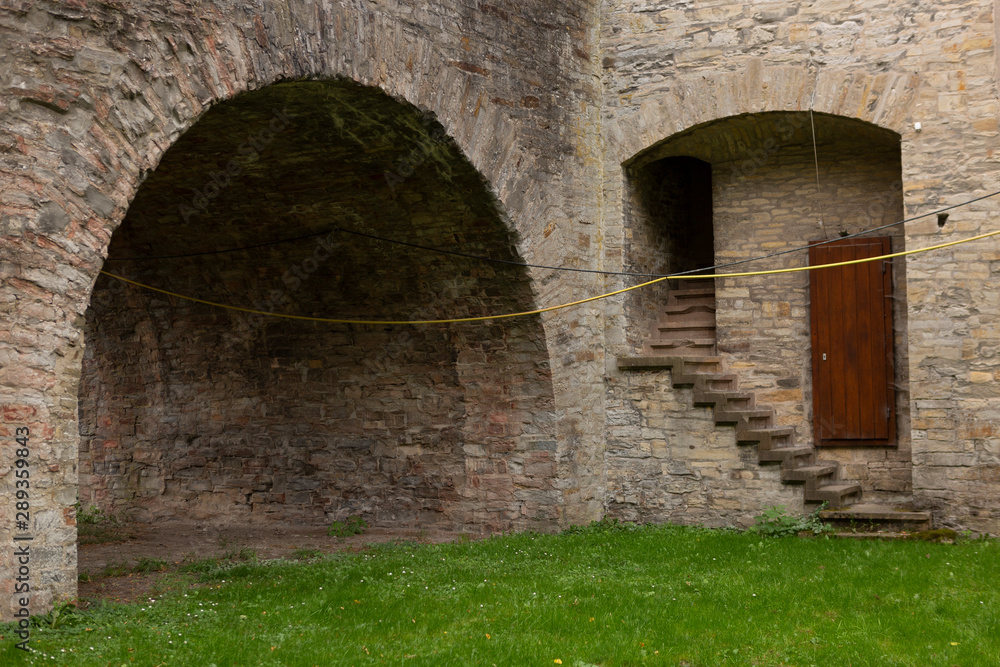 Architectural detail of the Wewelsburg castle with brick construction,  hidden staircase and door on the canal level and main entrance portal above