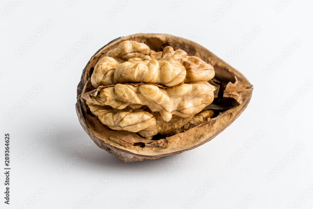 Half of cracked walnut isolated on white, top view Half of cracked walnut isolated on white, top view
