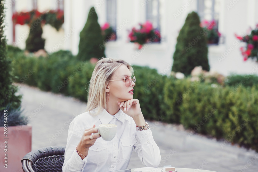 Portrait of businesswoman drinking hot cappuccino Portrait of businesswoman drinking hot cappuccino