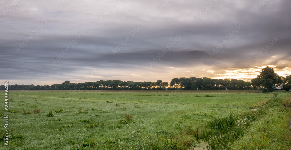 Dramatic sky over the dutch polder landscape
