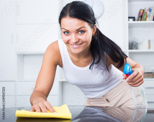 Young girl  cleaning in  house