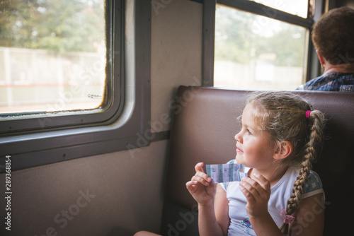 Cute little girl at a train station
