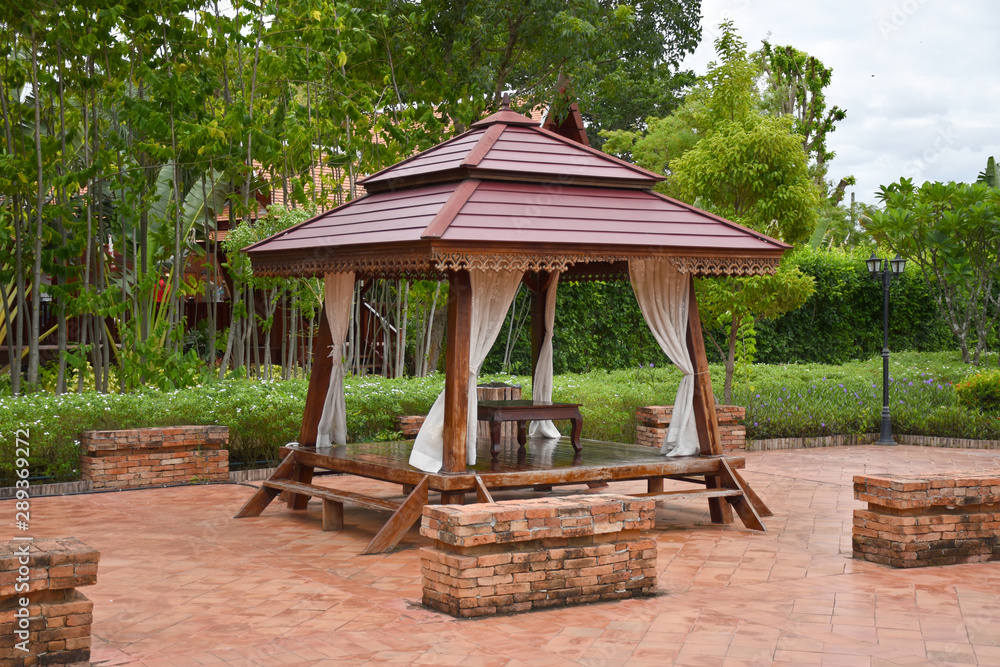 Kanchanaburi, Thailand, 09.09.2019: Beautiful garden, lake, traditional Thai, Siamese clothes, buildings of Kanchanaburi, Thailand, 09.09.2019: Beautiful garden, lake, traditional Thai, Siamese clothes, buildings of