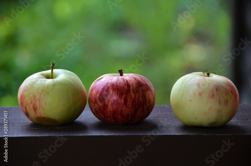 fresh apples on wooden table