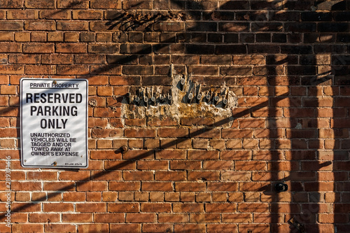 Photography Toronto, Ontario, Canada - May 2, 2015: Old brick factory wall perforated with s