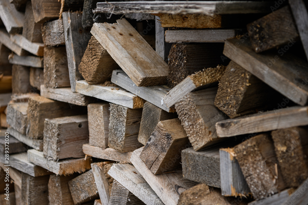 Wooden boards stacked one by one. Boards for construction work. Side view. Wooden boards stacked one by one. Boards for construction work. Side view.