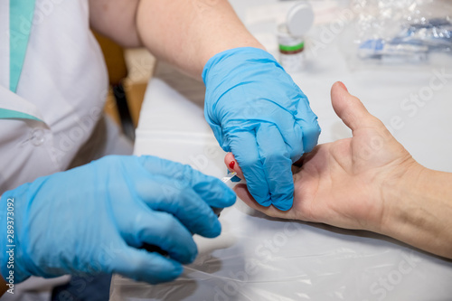 Wallpaper Mural Patient Hands Measuring Glucose Level Blood Test With Glucometer. Measuring glucose level ,test.Doctor making blood sugar test in clinic for diabetes.Doctor testing his patients blood at the hospital Torontodigital.ca