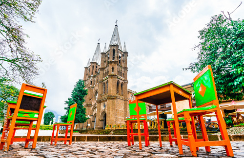 View on church and main square in colonial city El Jardin, Colombia, South America photo