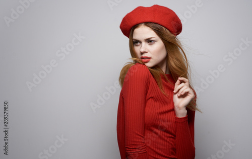 portrait of young woman in red hat © SHOTPRIME STUDIO