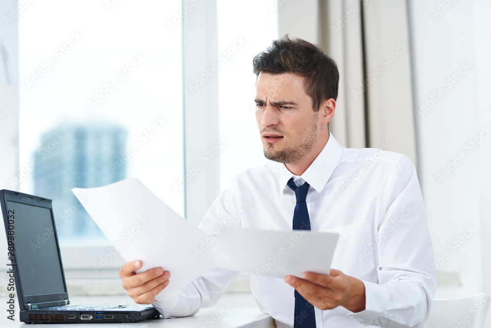 businessman working on his laptop in office businessman working on his laptop in office